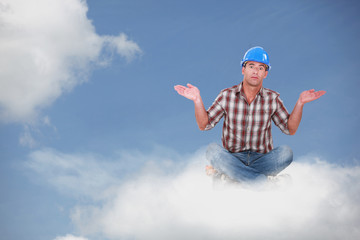 Montage of a handyman sitting on a cloud