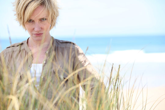 Blond Woman With Serious Expression At The Beach