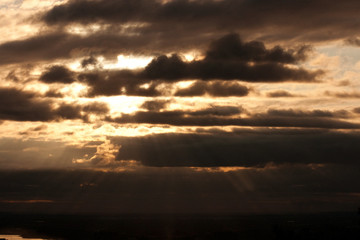 Fototapeta na wymiar Sunrise through clouds