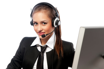 girl with a headset works at the computer