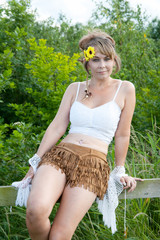 woman sitting on fence