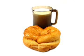 bun with cup of milk isolated on white background