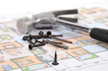 Hammer and nails on blueprint