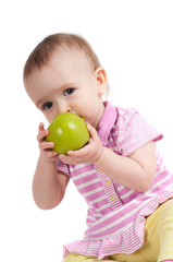 Baby girl in pink eating apple