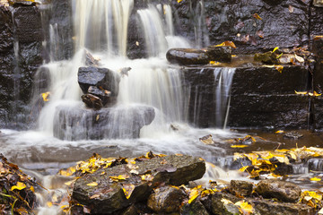 Waterfall with autumn leaves