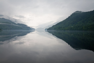 mist over the water and mountains