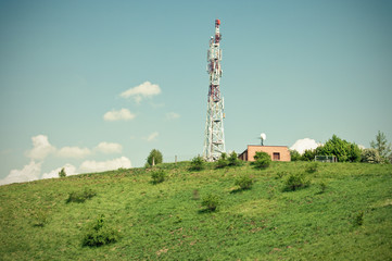 Green scene with transmitter on the hill