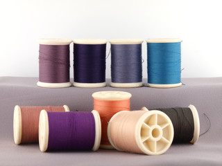 Threads in spools isolate on white background