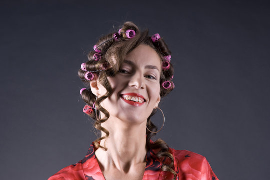 Beautiful young woman with bigoudi on the hair