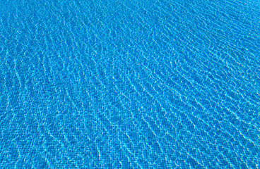 Fototapeta na wymiar Beautiful water surface in pool against a mosaic.