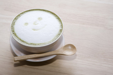 mini hot green tea on wood backgrounds