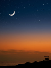 Moon and the stars on the beach