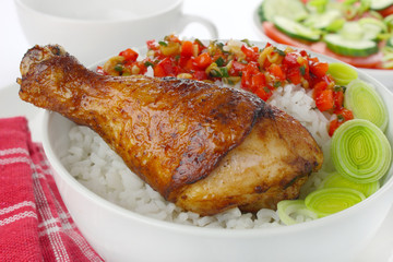 Fried chicken leg with rice and vegetables