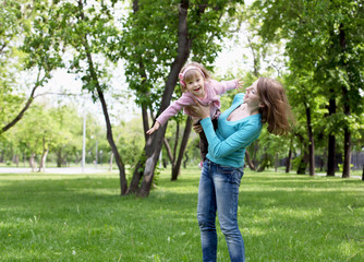 Portrait of mother with daughter outdoor