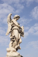 Fototapeta na wymiar Statue of an Angel on Pont Sant' Angelo in Rome, Italy.