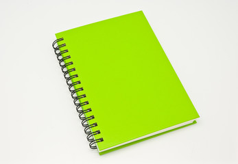 stack of ring binder book or green notebook