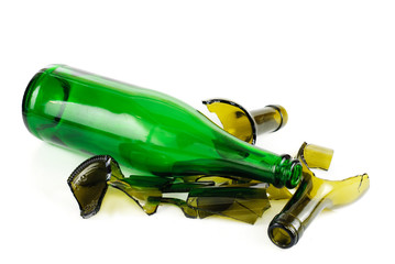 Whole and shattered green  bottle isolated on the white