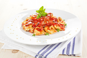 Tortellini with tomato sauce.