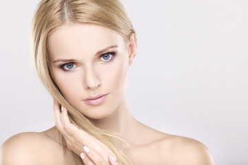 Naklejka premium Young pretty woman with beautiful blond hairs