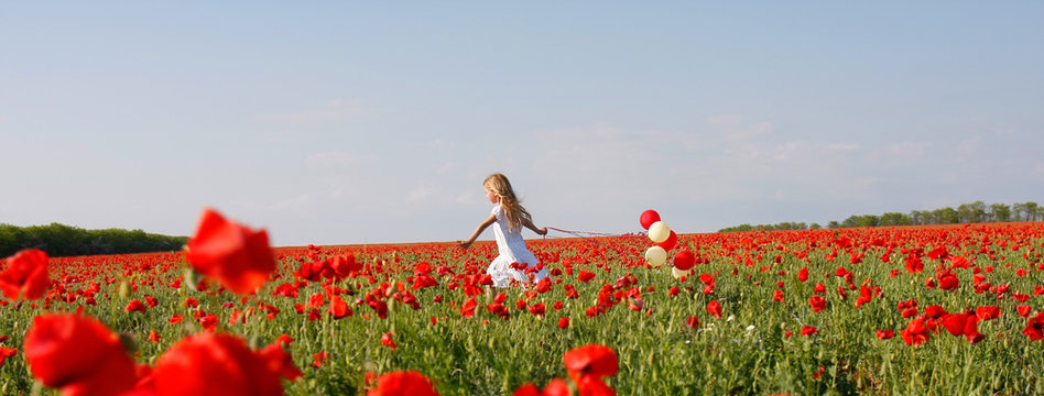 Young Girl Running In Poppy Field