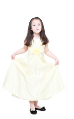 Obraz na płótnie Canvas five years' girl with long hair with an elegant dress