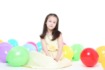 Fototapeta na wymiar five years' girl with long hair with an elegant dress
