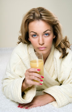 Portrait of the beautiful girl drinking juice