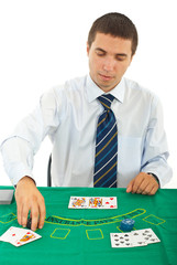 Man playing blackjack at casino