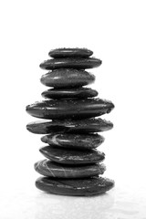 Fototapeta na wymiar stability and balance. tower of wet pebbles.