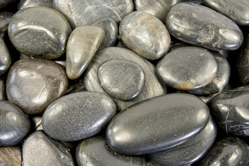 close up of black stones background (texture).