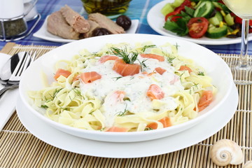 Tagliatelle pasta with cream, salmon and anise