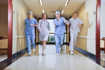 Team of surgeon and nurse running