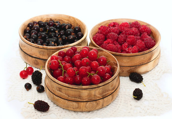 fresh berries in wooden bowls