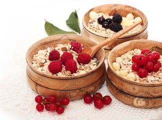 wooden bowls with cereals and berries