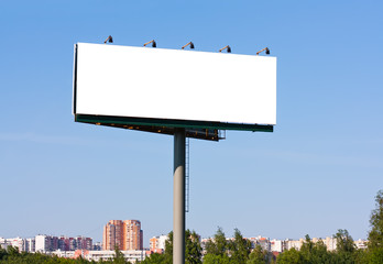 Blank billboard over blue sky