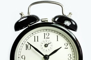 front view of an antique clock on a white background black