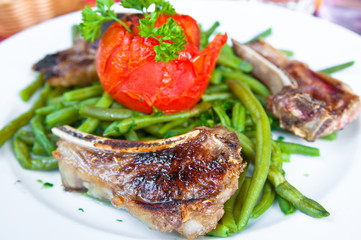 juicy grilled pork leg with fresh salad