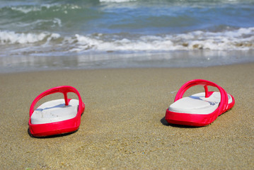 Ravenna, Adriano beach flip-flops on the sand