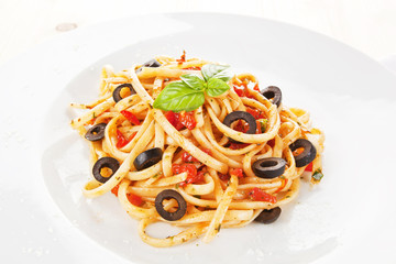 Pasta with tomato sauce and olives.