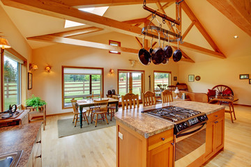 Large living room on the horse ranch with the kitchen.