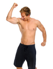 Excited athlete raises his arms for victory