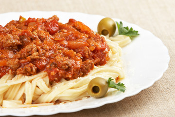 Italian cuisine. Pasta with meat sauce