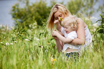 Fototapeta premium Mother and Son in Grass Field
