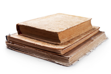 Pile of old vintage books isolated on white background