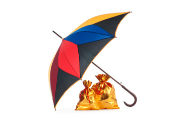 Golden sacks under protection of umbrella