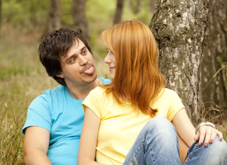 Couple at the park in summer day.