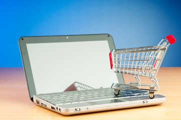 Internet online shopping concept with computer and cart