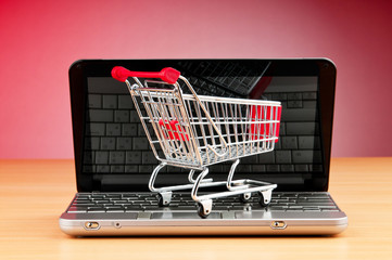 Internet online shopping concept with computer and cart