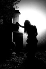 Angel on the grave - dramatic lighting