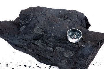 a lump of coal and compass